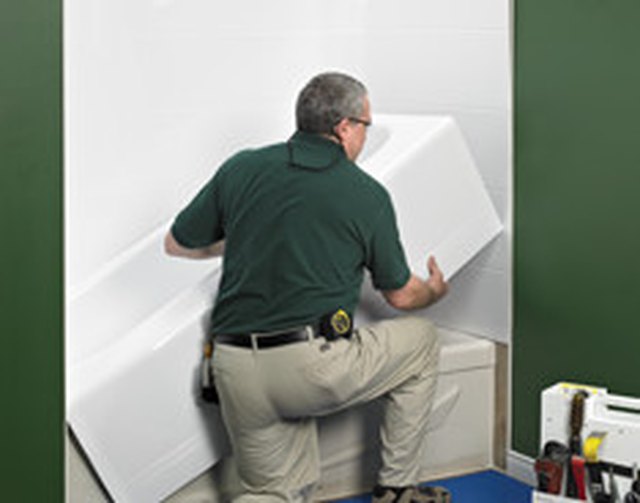 Tub liner being put in place.