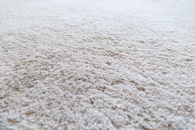 Close-up of a white shaggy carpet, shallow depth of field