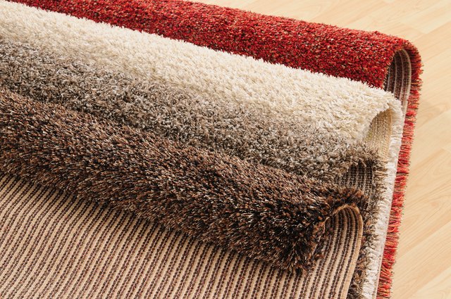 How To Stop Rugs Moving On Carpet Hunker, How To Keep Area Rug From Sliding On Carpet