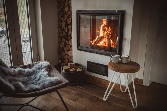 How do I clean my ceramic wood stove glass?