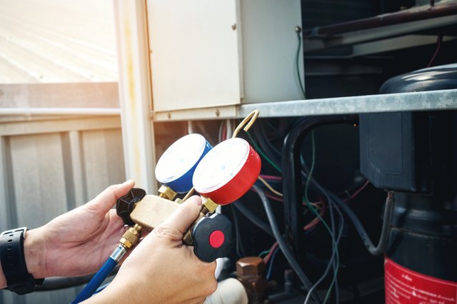 Technician is checking air conditioner