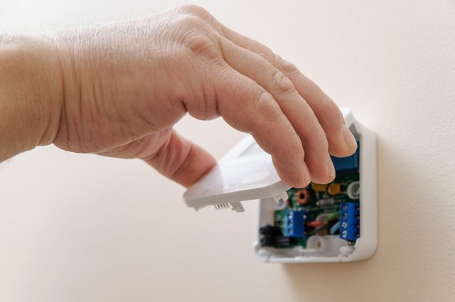 Installing a programmable room thermostat.