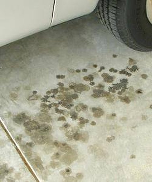How to Get Oil Stains Off of a Driveway Hunker