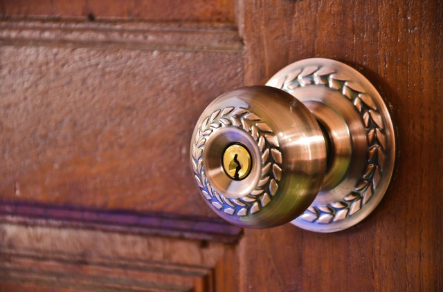 metal handle on a wooden door