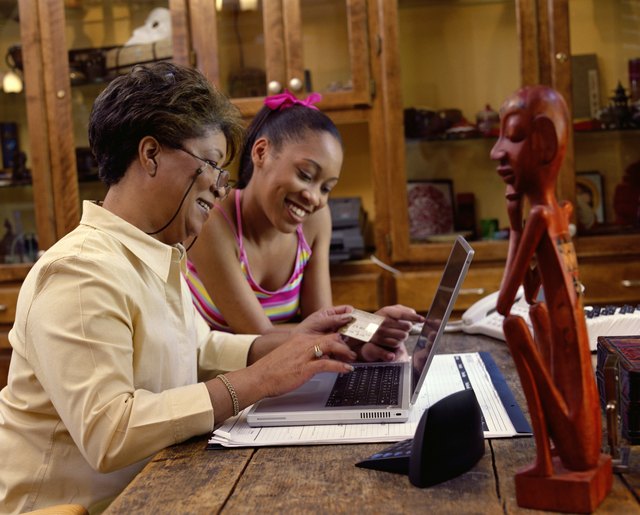 Grandmother and granddaughter shopping online