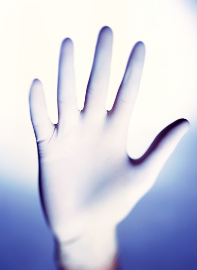 close-up of a hand wearing a latex glove