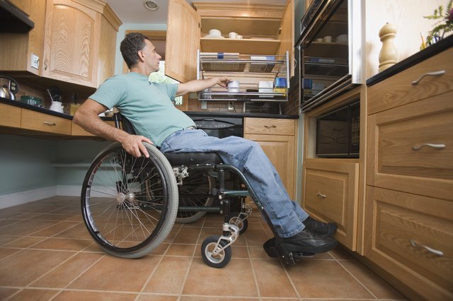 Man using wheelchair in kitchen
