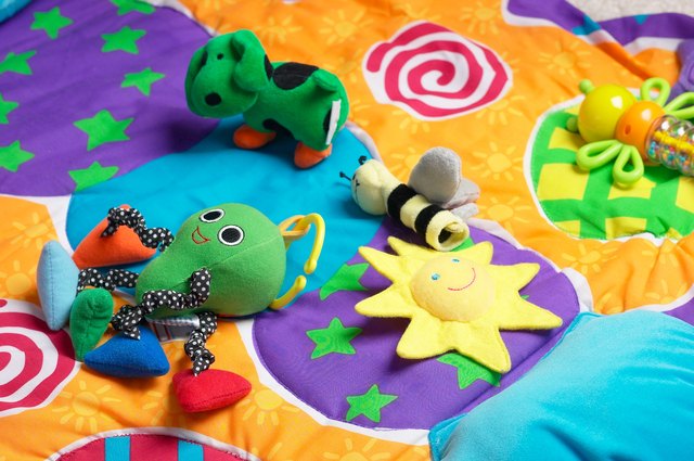 Baby toys on colorful blanket