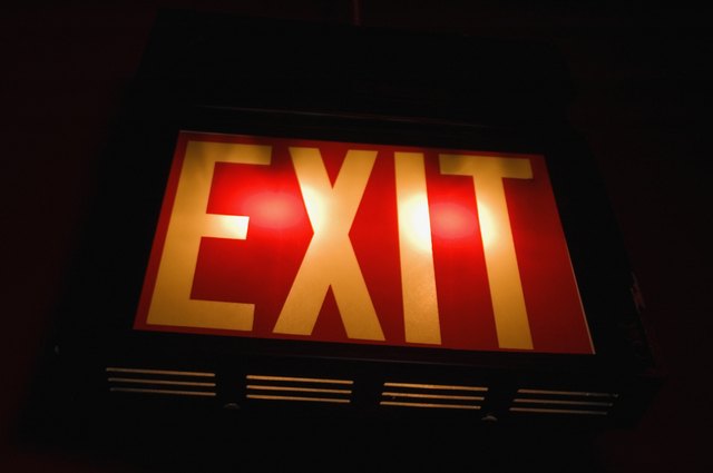 A close-up of backlit exit sign