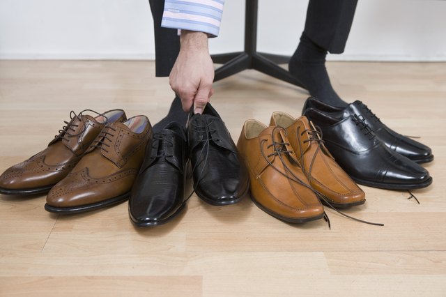 Man with variety of footwear