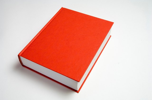 Blank red book on white.