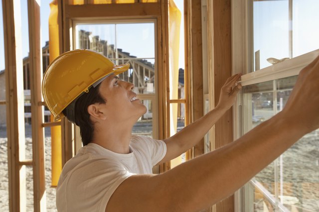 Construction Worker Building a House