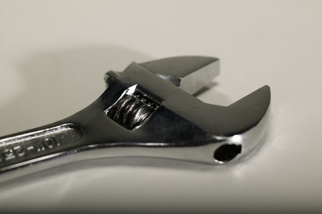Spanner wrench lying on table, close-up