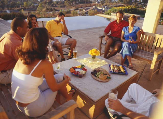 Group of friends having patio meal on vacation