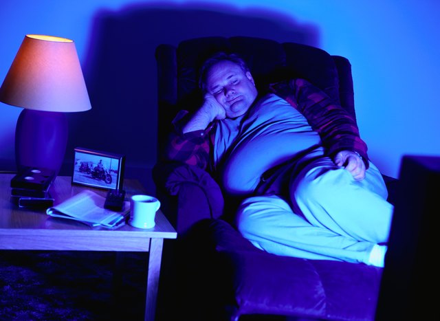 Man in a Recliner Chair Watching Television