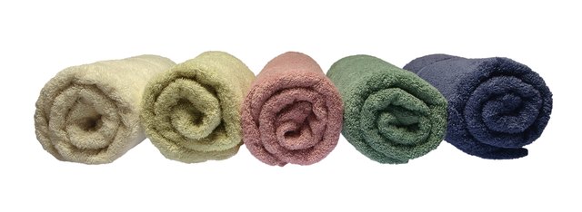 Towels, rolled, arranged in row