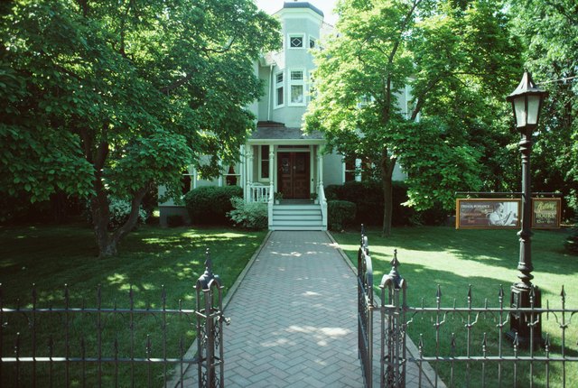 Open gate leading to house
