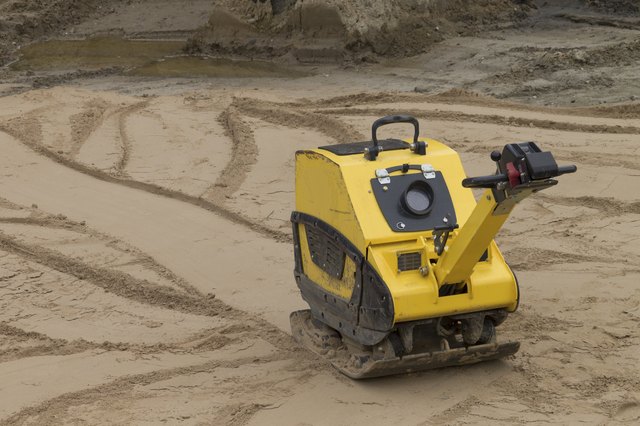 Compaction of sand before the construction road