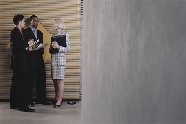 Businesspeople standing in hallway