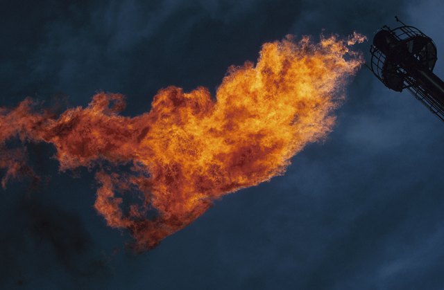 Gas flame flaring from vent at refinery