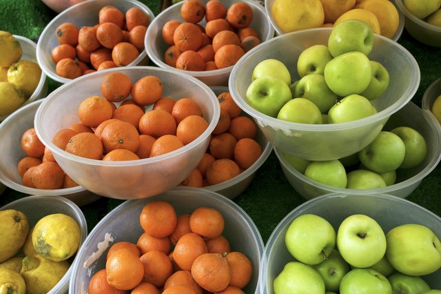 Fruit displayed in bowls at a market