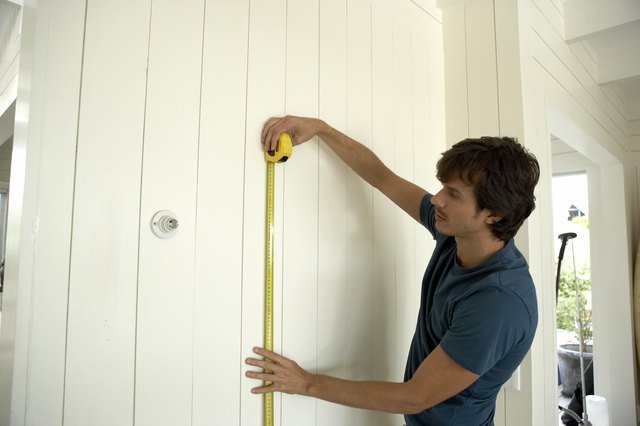 Man measuring socket height