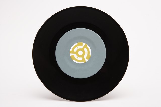 7-inch record with plastic 45-rpm adapter in center