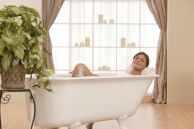 Woman relaxing in bathtub