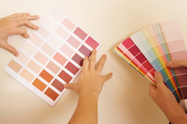 Hands with paint samples