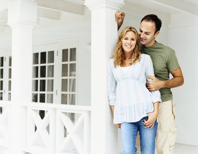Portrait of a Couple Standing Together on Their Porch