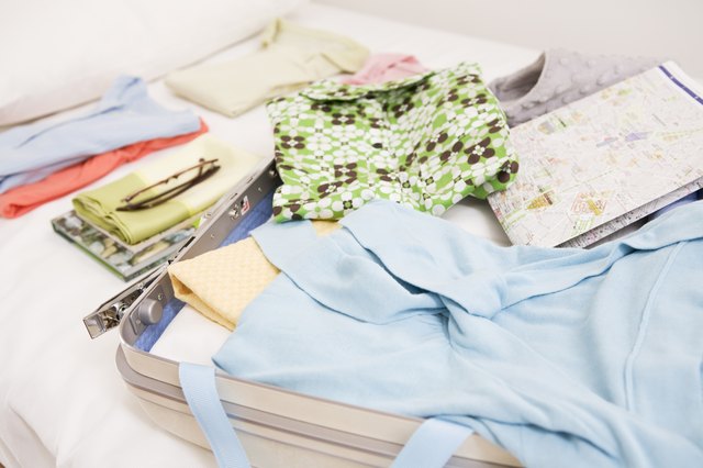 Packing clothes in the bedroom