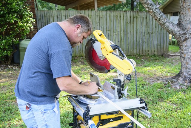 Man using power miter saw