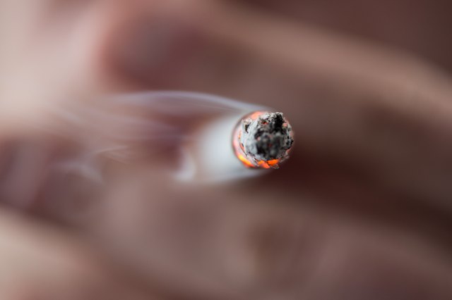 Focus on tip of burning cigarette