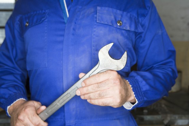 Hands of man with wrench