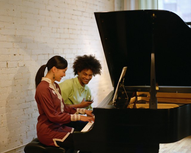 Couple sitting at piano