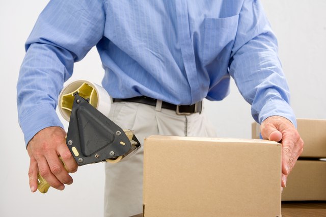 Man taping box