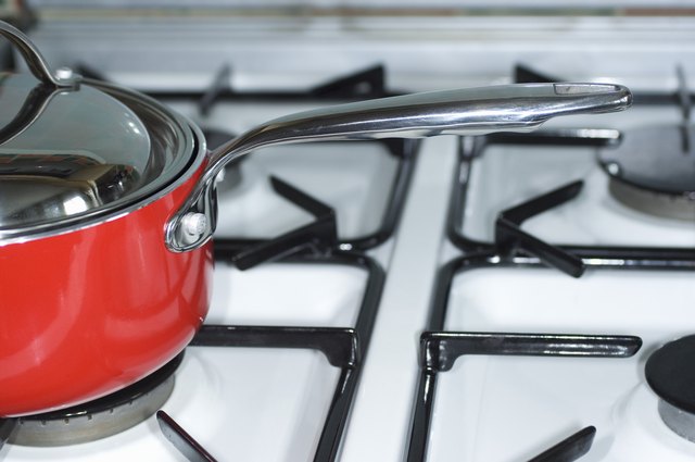 how-to-clean-burnt-on-grease-off-enamel-gas-stove-burners-hunker