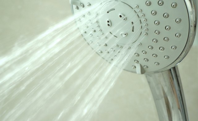 close up on head shower while running water