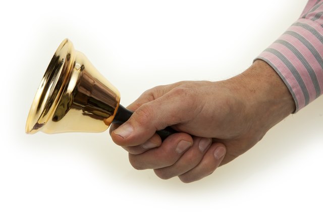Hand with brass bell