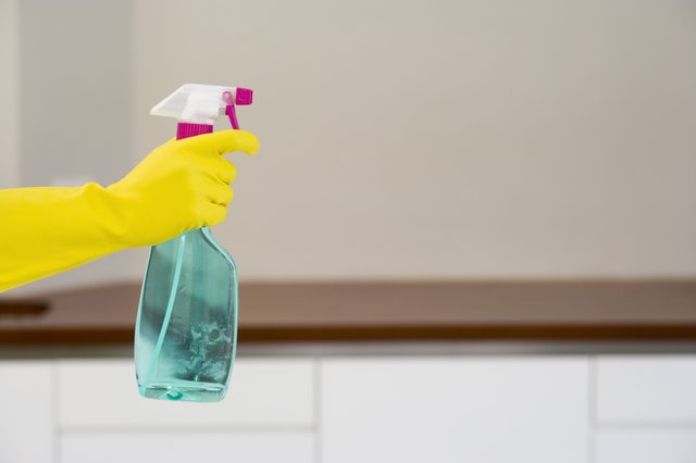Hand with spray bottle