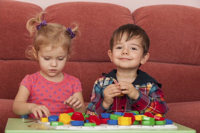 Two children playing at the table