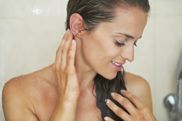 young woman washing in shower