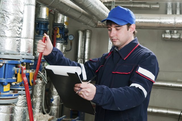 heating engineer in boiler room