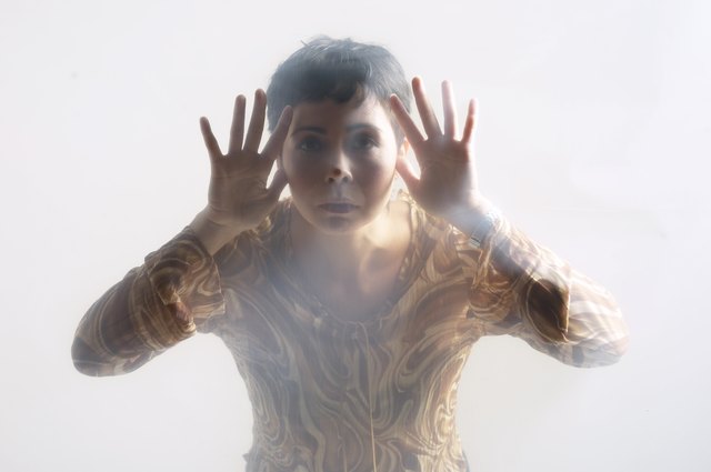 Woman looking through glass