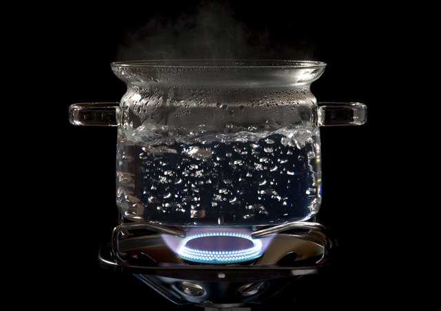 clear cooking pot on a gas stove