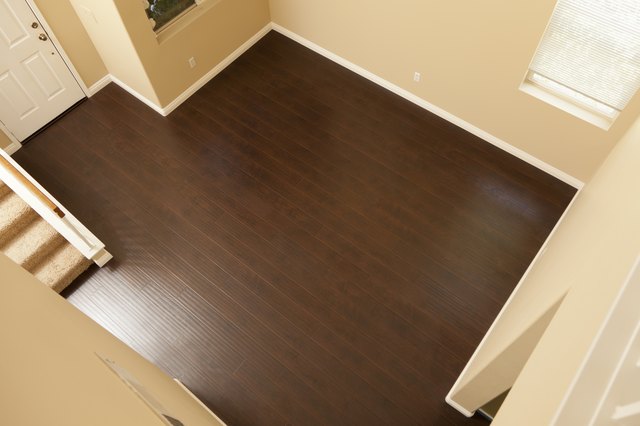 Newly Installed Brown Laminate Flooring and Baseboards in Home