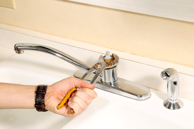 single handle kitchen sink leaking at base