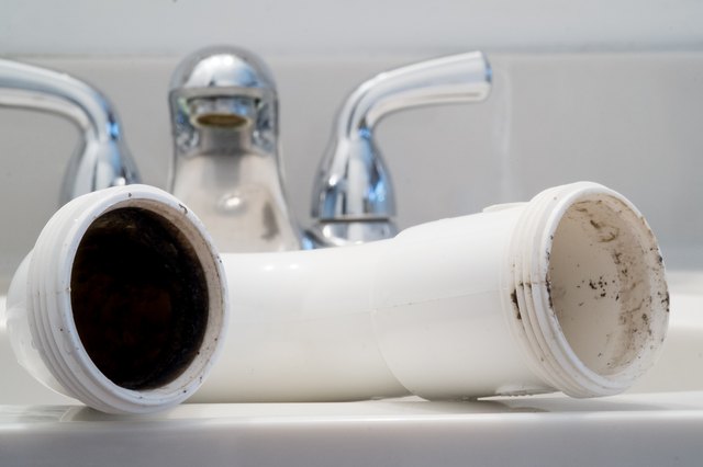 How To Clean Black Sludge In Bathroom Sink Drains Hunker - What Causes Black Mold In Bathroom Sink Drain