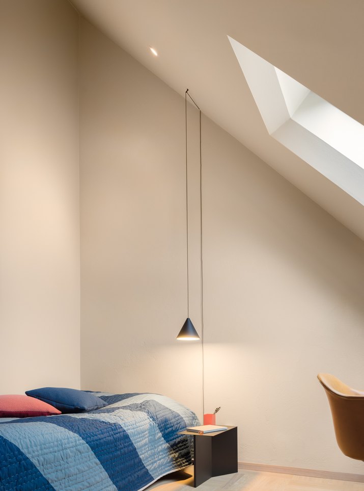 Bedroom with pendant light and skylight