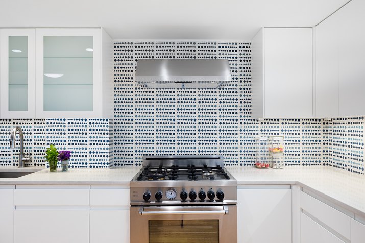 white kitchen with patterned tile backsplash